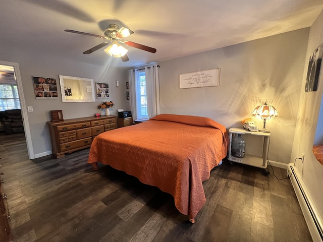 bedroom with baseboard heating, multiple windows, ceiling fan, and dark hardwood / wood-style floors