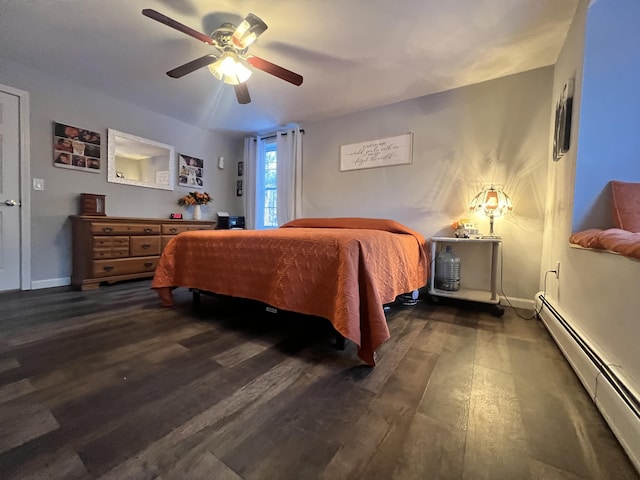 bedroom featuring ceiling fan, a baseboard radiator, and dark hardwood / wood-style floors