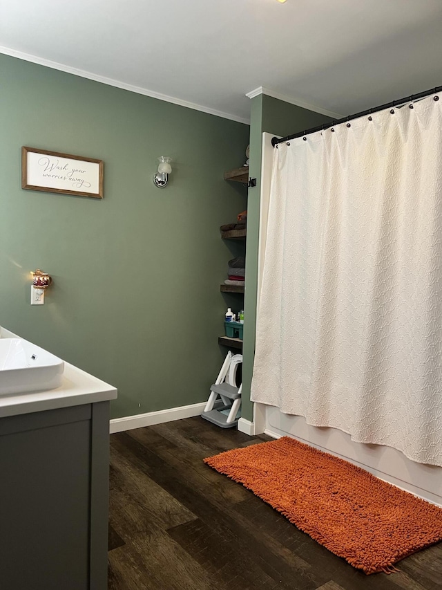 701 Stetson Rd, Exeter, ME 04435 - bathroom with crown molding, wood finished floors, vanity, and shower / bathtub combination with curtain