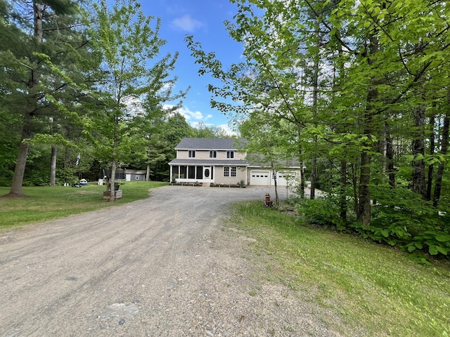 701 Stetson Rd, Exeter, ME 04435 - view of front of house featuring driveway, a front yard, and an attached garage