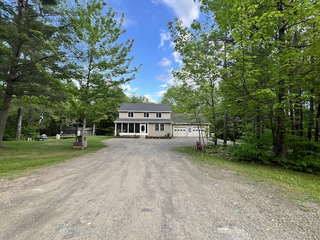 701 Stetson Rd, Exeter, ME 04435 - view of front of property with driveway, a garage, and a front lawn
