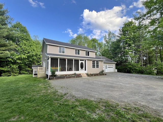 701 Stetson Rd, Exeter, ME 04435 - view of front of house with a sunroom, a front lawn, and entry steps