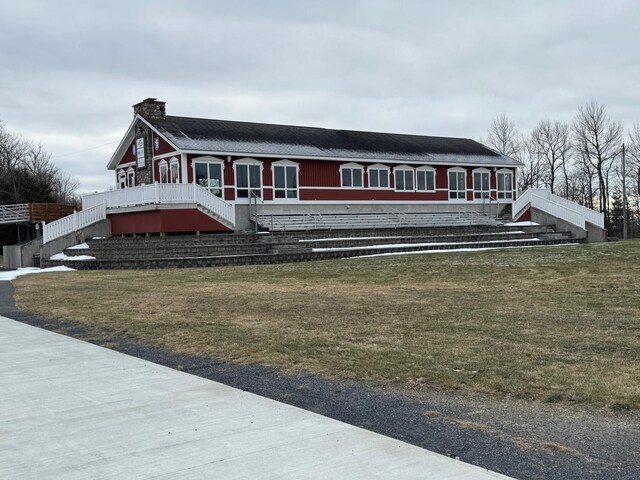450 Fort Fairfield Rd, Presque Isle, ME 04769 - view of front of property featuring a chimney, stairway, and a front yard