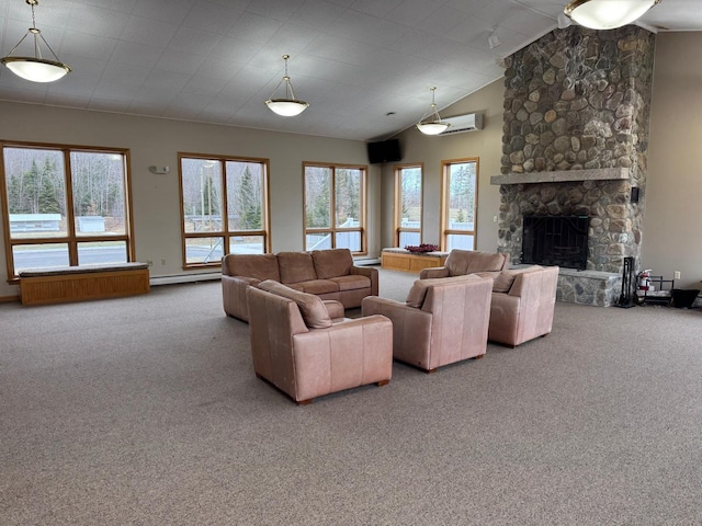 living room featuring a stone fireplace, carpet, and a wall mounted AC