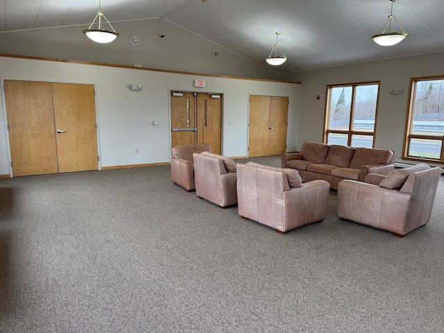 unfurnished living room with carpet floors and lofted ceiling