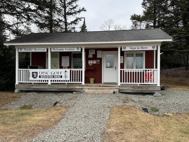 450 Fort Fairfield Rd, Presque Isle, ME 04769 - view of front of house featuring a shingled roof and covered porch