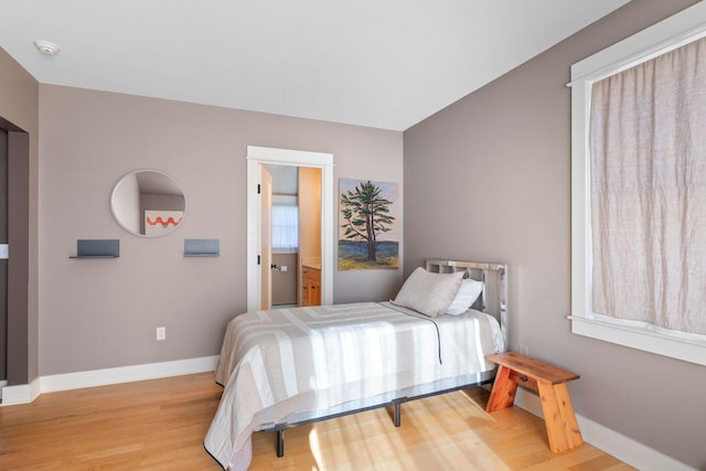 bedroom with light wood-type flooring