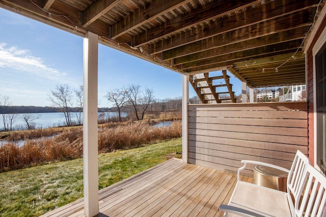 wooden deck with a water view