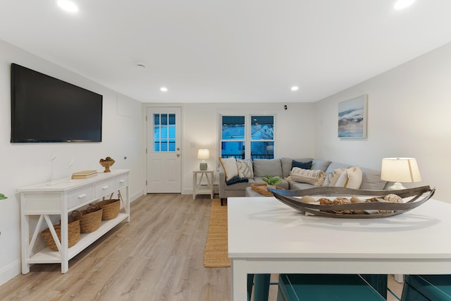 living room with light hardwood / wood-style floors