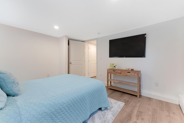 bedroom with light wood-type flooring