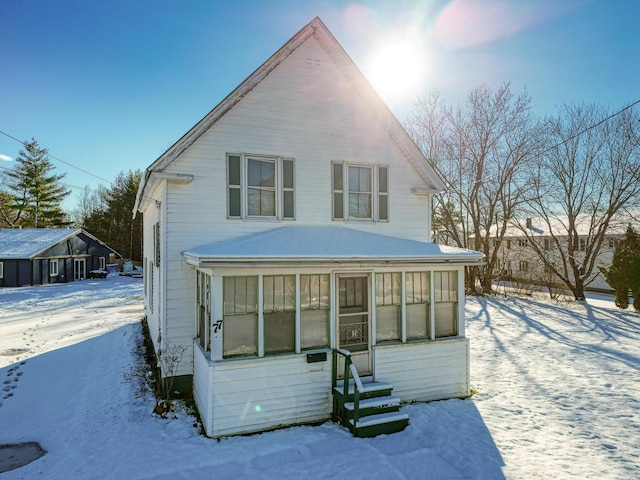 view of front of home with a sunroom