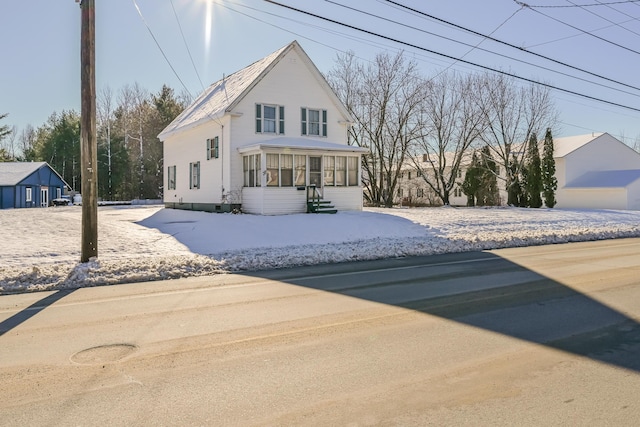 front of property featuring a sunroom