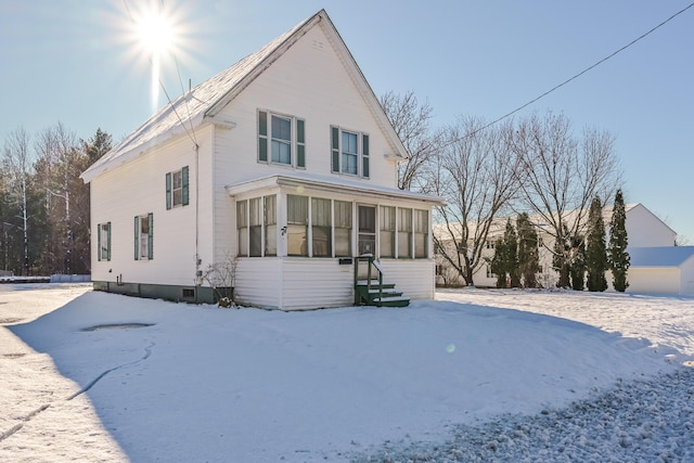 view of front of property with a sunroom