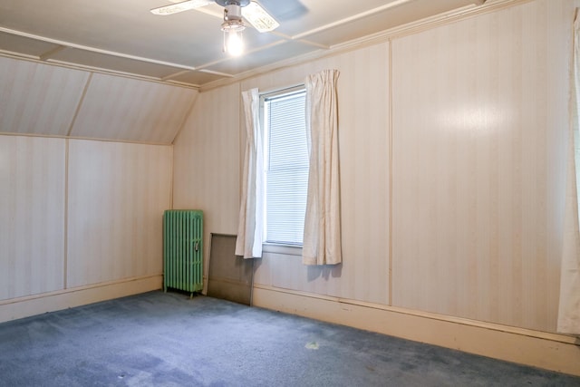 bonus room featuring carpet, radiator, vaulted ceiling, ceiling fan, and plenty of natural light