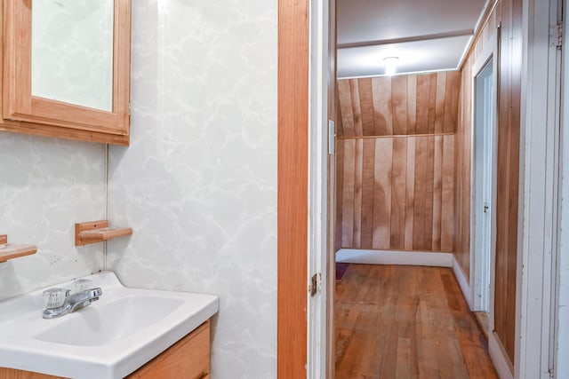 bathroom with vanity and hardwood / wood-style flooring