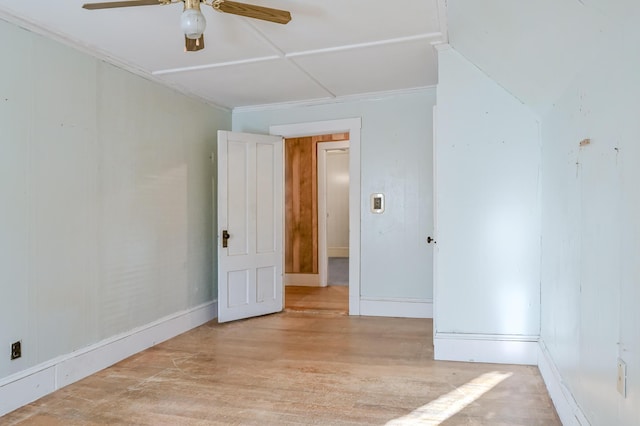 empty room featuring ceiling fan and light hardwood / wood-style flooring