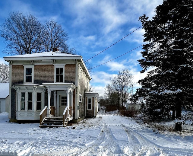 view of snow covered house