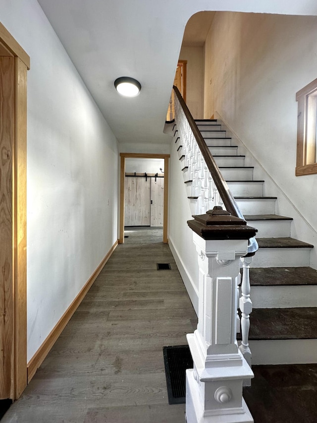 staircase featuring hardwood / wood-style floors