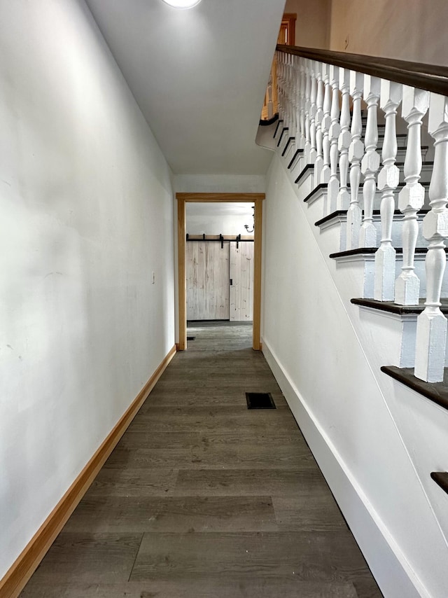 corridor featuring dark hardwood / wood-style flooring