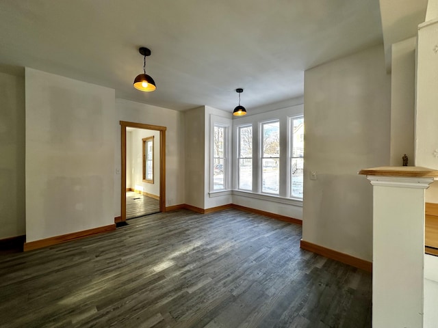 unfurnished living room with dark hardwood / wood-style flooring