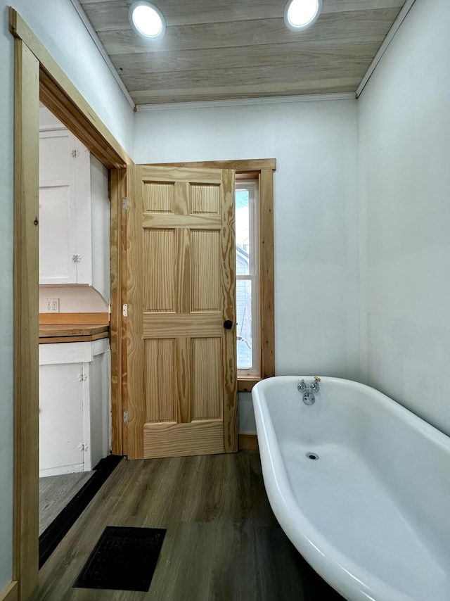 bathroom featuring a bathing tub and wood-type flooring