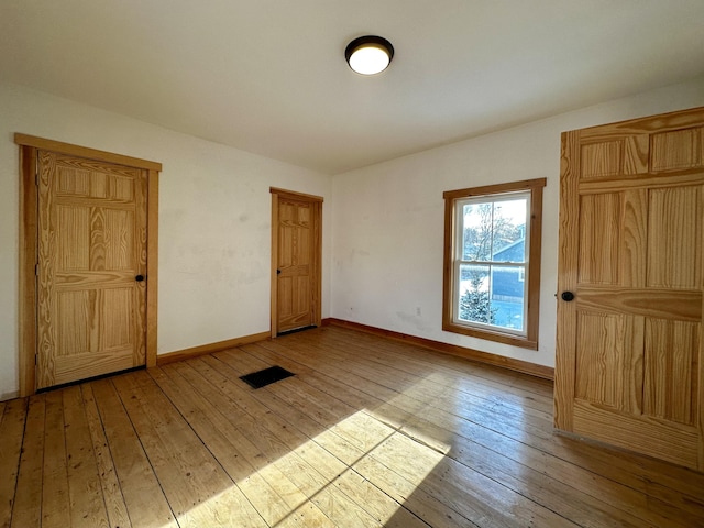 unfurnished room featuring light hardwood / wood-style flooring