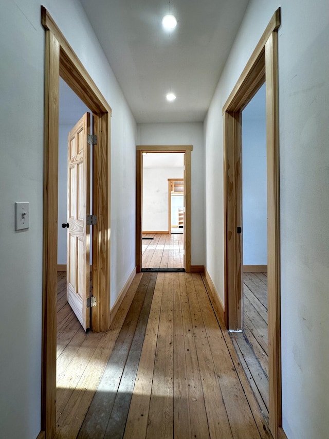 corridor featuring light hardwood / wood-style flooring