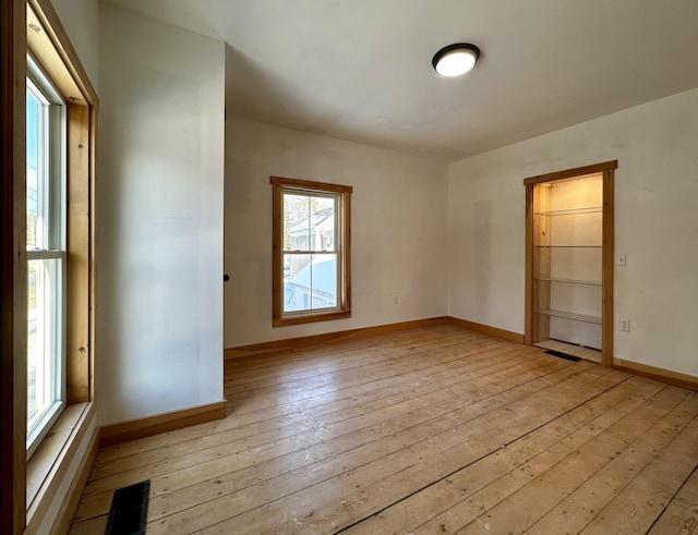 spare room with light hardwood / wood-style flooring