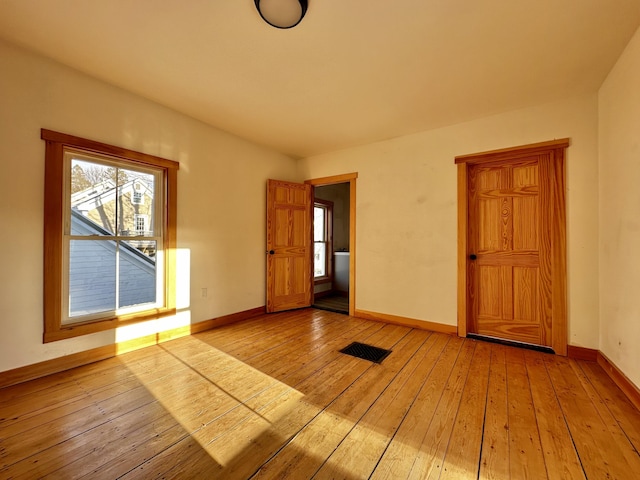 spare room featuring light hardwood / wood-style floors