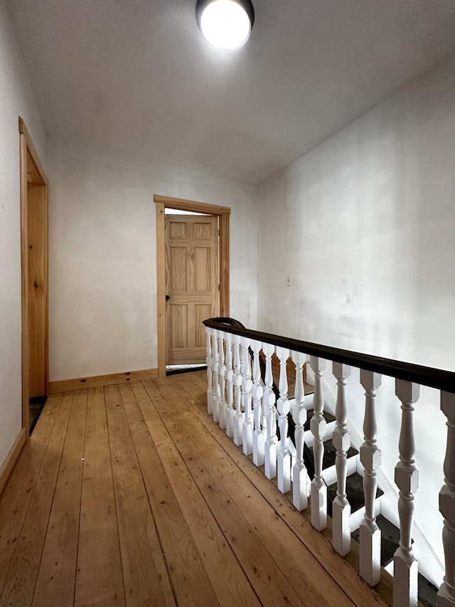 hall with light hardwood / wood-style floors