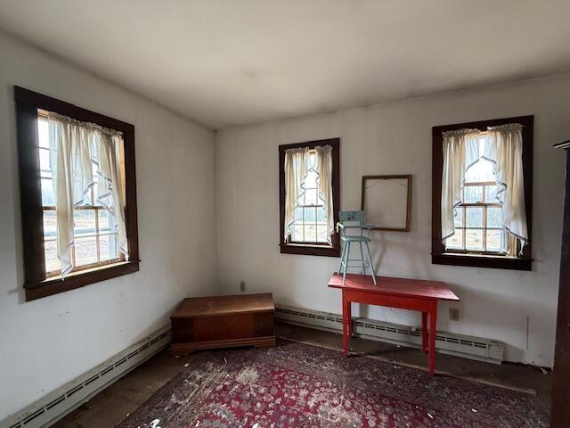 21 Talmadge Rd, Talmadge, ME 04492 - sitting room featuring a baseboard radiator and healthy amount of natural light