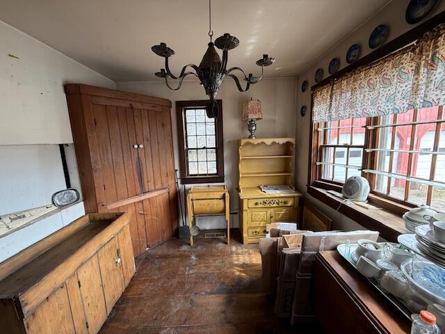 21 Talmadge Rd, Talmadge, ME 04492 - misc room with a chandelier and dark wood-style flooring