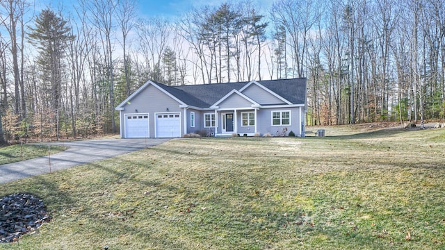 view of front of property with a garage and a front lawn