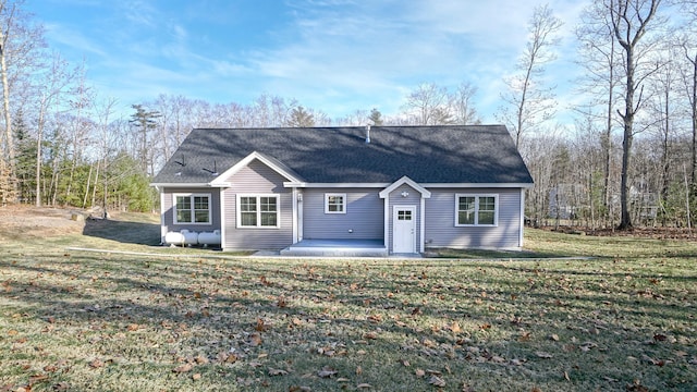 view of front facade featuring a patio and a front lawn