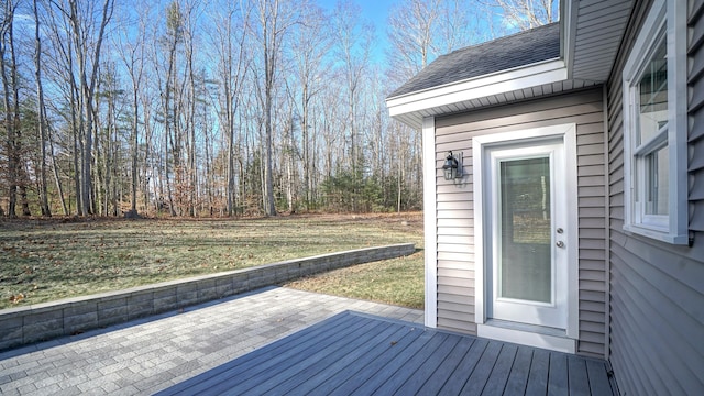 deck with a yard and a patio