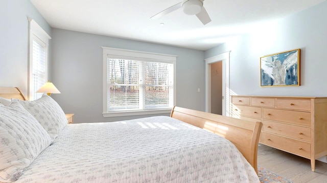 bedroom featuring ceiling fan and hardwood / wood-style flooring