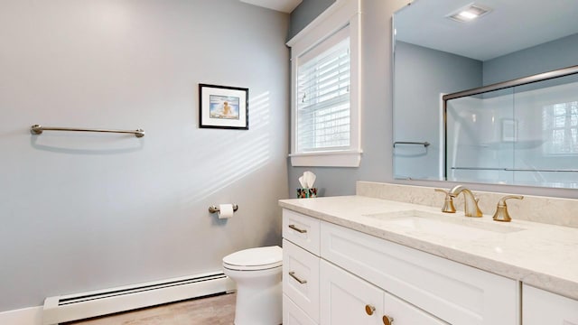 bathroom with vanity, toilet, baseboard heating, and walk in shower