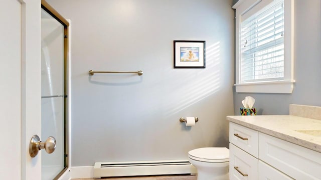 bathroom featuring toilet, vanity, an enclosed shower, and a baseboard heating unit