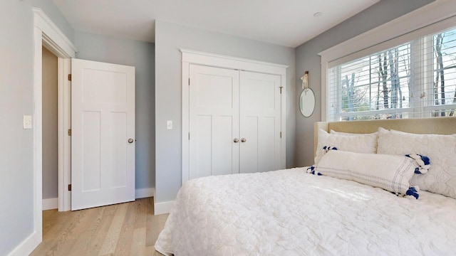 bedroom featuring a closet and light hardwood / wood-style flooring