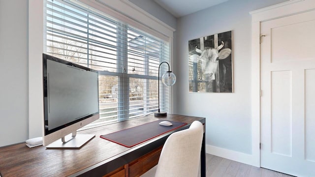 home office with hardwood / wood-style flooring