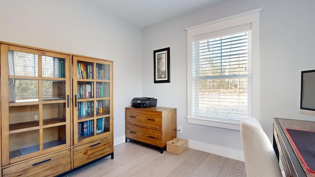 office area with light hardwood / wood-style flooring