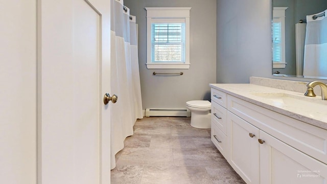 bathroom featuring vanity, toilet, and a baseboard radiator