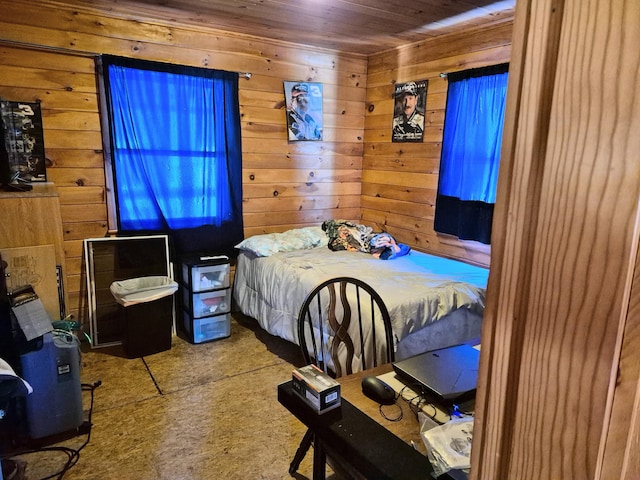 bedroom featuring wooden walls and wood ceiling