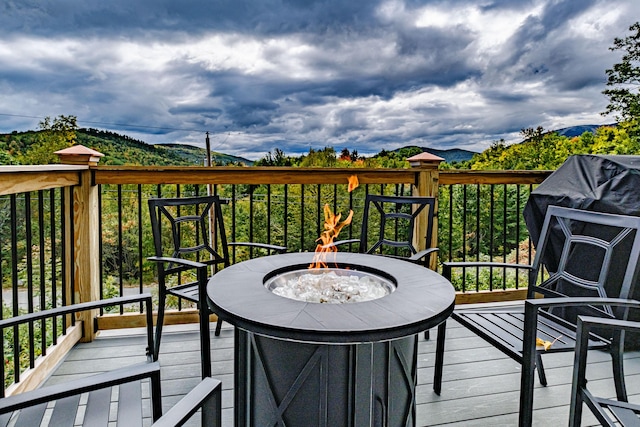 deck with an outdoor fire pit