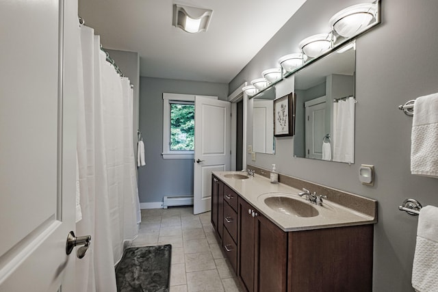 bathroom featuring baseboard heating, tile patterned floors, and vanity