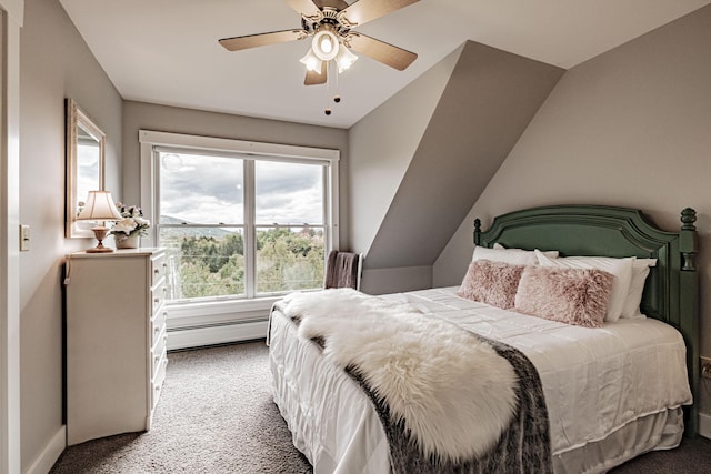 carpeted bedroom with vaulted ceiling, baseboard heating, and ceiling fan