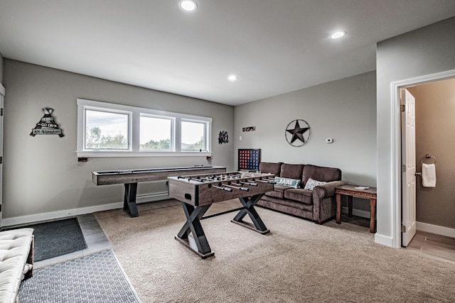 recreation room featuring light colored carpet