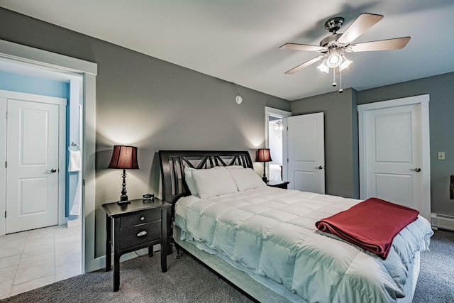 bedroom with ceiling fan and light tile patterned floors