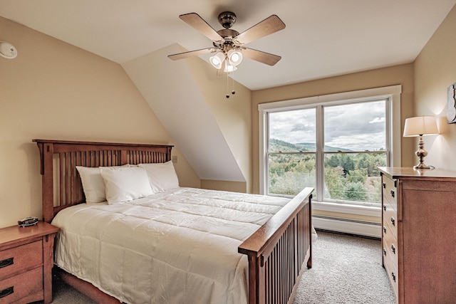 bedroom featuring ceiling fan, light carpet, vaulted ceiling, and a baseboard heating unit