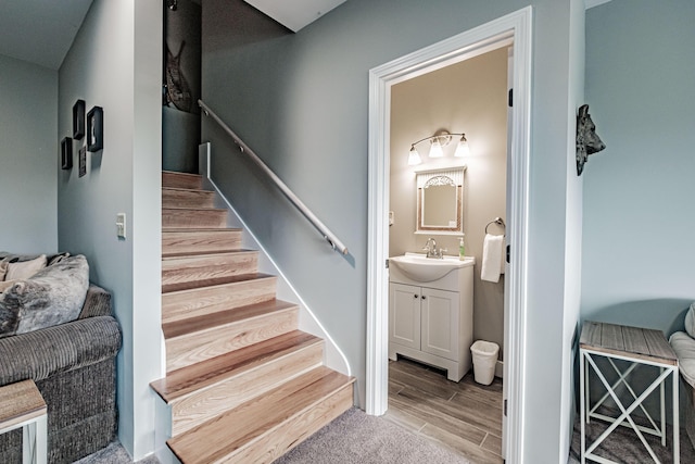 stairway featuring sink